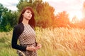 Beautiful woman enjoying daisy field, nice female lying down in meadow of flowers, pretty girl relaxing outdoor, having fun, Royalty Free Stock Photo