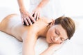 Beautiful woman enjoying hot stone massage Royalty Free Stock Photo