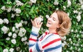 Spring allergy. Beautiful woman enjoying nature blooming tree. Royalty Free Stock Photo