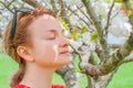 Spring allergy. Beautiful woman enjoying nature blooming tree Royalty Free Stock Photo