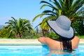 Beautiful woman enjoying sun at swimming pool Royalty Free Stock Photo