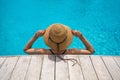 Beautiful woman enjoying in the swimming pool. Girl relaxing on pool in hot sunny day. Summer holiday idyllic. Pool party Royalty Free Stock Photo
