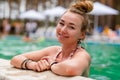 Beautiful woman enjoying in swimming pool Royalty Free Stock Photo