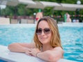 Beautiful woman enjoying in swimming pool Royalty Free Stock Photo