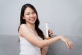 A beautiful woman is epilating and removing hair using an IPL laser hair removal epilator device