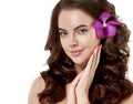 Beautiful woman face close up portrait long beautiful hair with flower young. Royalty Free Stock Photo