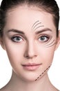 Beautiful woman face with correction lines. Royalty Free Stock Photo