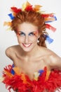 Beautiful woman with face framed in feathers Royalty Free Stock Photo