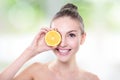 Beautiful woman face with juicy orange Royalty Free Stock Photo