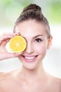 Beautiful woman face with juicy orange Royalty Free Stock Photo
