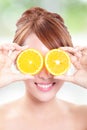 Beautiful woman face with juicy orange Royalty Free Stock Photo