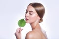 Beautiful woman face portrait with green leaf concept for skin care or organic cosmetics. Studio portrait Royalty Free Stock Photo