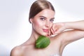 Beautiful woman face portrait with green leaf concept for skin care or organic cosmetics. Studio portrait Royalty Free Stock Photo