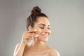 Beautiful Woman Face Skin Care. Portrait Of Attractive Young Female Applying Cream Cosmetics. Closeup Of Beauty Smiling Girl With Royalty Free Stock Photo