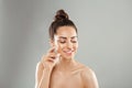 Beautiful Woman Face Skin Care. Portrait Of Attractive Young Female Applying Cream Cosmetics. Closeup Of Beauty Smiling Girl With Royalty Free Stock Photo