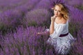 Beautiful woman in a field of blossoming lavender Royalty Free Stock Photo