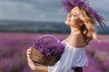 Beautiful woman in a field of blossoming lavender Royalty Free Stock Photo