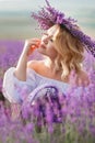 Beautiful woman in a field of blossoming lavender Royalty Free Stock Photo