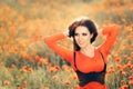 Beautiful Woman in a Field of Poppies Royalty Free Stock Photo