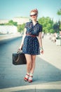 Beautiful woman in fifties style with braces smiling