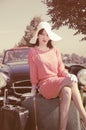 Beautiful woman in fifties style, road trip