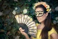 Beautiful Woman with Floral Wreath, Mask and Fan