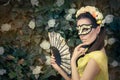 Beautiful Woman with Floral Wreath, Mask and Fan