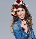 Beautiful woman in flower crown holding sunglasses Royalty Free Stock Photo