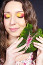 Beautiful woman with a flower in her hand