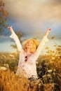 Beautiful woman in a flower meadow with sunhat and sunglasses, lust for life Royalty Free Stock Photo