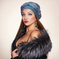 Beautiful woman in fur and turban