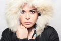 Beautiful woman with fur. white hood. winter style.make-up Royalty Free Stock Photo
