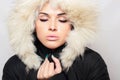 Beautiful woman with fur. white hood. winter style.make-up Royalty Free Stock Photo