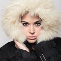 Beautiful woman with fur. white hood. winter style.make-up Royalty Free Stock Photo