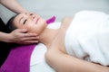 Beautiful woman is getting a facial massage in the spa salon Royalty Free Stock Photo
