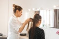 Beautiful woman getting haircut by hairdresser in the beauty salon. Royalty Free Stock Photo