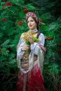 Ethnic russian national costume attire woman with a bouquet