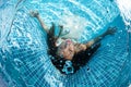 Beautiful woman girl white dress underwater diving swim blue sunny day pool Royalty Free Stock Photo