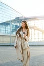 Beautiful Woman Going To Work With Coffee Walking Near Office Building. Portrait Of Successful Business Woman Holding Cup Of Hot D Royalty Free Stock Photo