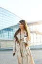 Beautiful Woman Going To Work With Coffee Walking Near Office Building. Portrait Of Successful Business Woman Holding Cup Of Hot D Royalty Free Stock Photo