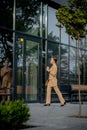 Beautiful Woman Going To Work With Coffee Walking Near Office Building. Portrait Of Successful Business Woman Holding Cup Of Hot Royalty Free Stock Photo