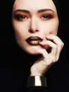 Beautiful woman,gold jewelry.face like a mask Royalty Free Stock Photo