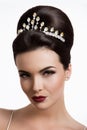 Beautiful woman with gold makeup.Beautiful bride with fashion wedding hairstyle. Royalty Free Stock Photo