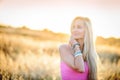 A beautiful woman in golden hay field 4 Royalty Free Stock Photo