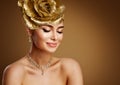 Beautiful Woman in Golden Wedding Jewelry Set. Beauty Model in Gold Tiara and Necklace. Fashion Girl Face Portrait Make up Royalty Free Stock Photo