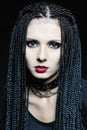 Beautiful woman in gothic shape with pigtails . Royalty Free Stock Photo