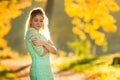 Beautiful Woman in green dress on Fall Nature Background Royalty Free Stock Photo