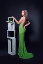 Beautiful woman in a green evening dress on a black background Royalty Free Stock Photo