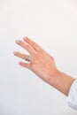 Woman hand with Bold Adjustable Silver Ring set against a white background