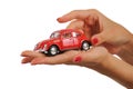 beautiful woman hand holding a red nostalgic toy car Royalty Free Stock Photo